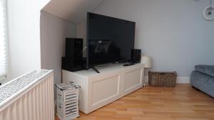 TV a/nebo společenská místnost v ubytování Sea Lounge