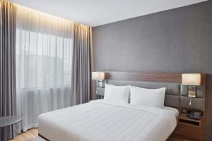 AC Hotel by Marriott Saltillo客房内的一张或多张床位