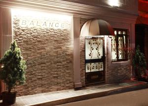 a store front with a door with a sign on it at Balance Hotel Taksim in Istanbul