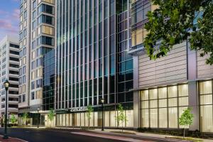 a rendering of a tall building with a street at AC Hotel by Marriott Bethesda Downtown in Bethesda