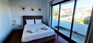 Postel nebo postele na pokoji v ubytování Luxury Villas