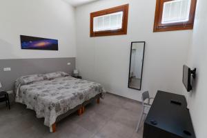 TV a/nebo společenská místnost v ubytování Agriturismo Oasi Bettella