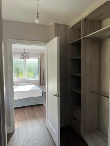 a bedroom with a bed and a window at Holiday Home in Leap in Leap