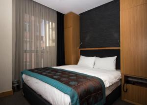 Postel nebo postele na pokoji v ubytování Le Marde Hotel