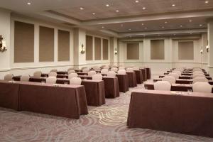 a large room with rows of tables and chairs at Courtyard by Marriott New Orleans French Quarter/Iberville in New Orleans