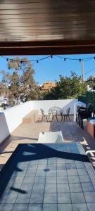 a view of a patio with benches and tables at Casa Rural La Fuensanta in Mojácar
