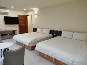 Uma cama ou camas num quarto em Xitou Tianpin Homestay