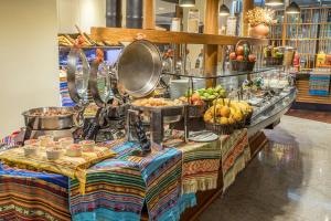 a buffet with fruits and vegetables on a table at Sheraton Quito in Quito