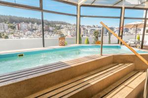 a swimming pool with a view of a city at Sheraton Quito in Quito