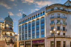 a white building with a dome on top of it at Querencia de Sevilla, Autograph Collection in Seville +107 photos