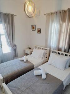 Ένα ή περισσότερα κρεβάτια σε δωμάτιο στο Villa Mimika