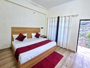 Postel nebo postele na pokoji v ubytování Hotel Aashirwad