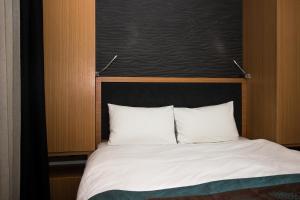 Postel nebo postele na pokoji v ubytování Le Marde Hotel