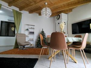 a dining room with a table and chairs at Best View Kolasin in Kolašin