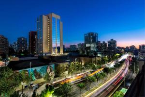 a city skyline at night with a train at Le Méridien Santiago in Santiago