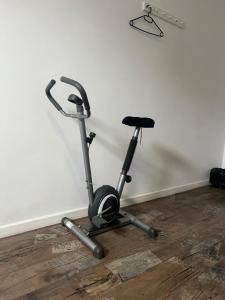 a exercise bike is parked next to a wall at Krakus in Kraków