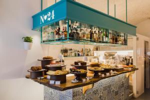 a buffet of food and drinks on a table at Santa Maria 24 in Monopoli +44 photos