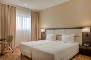 a large white bed in a hotel room at AC Hotel by Marriott Milan Sesto in Sesto San Giovanni +36 photos