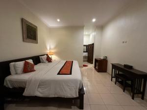 Postel nebo postele na pokoji v ubytování Brata Inn Ubud