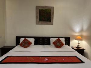 Postel nebo postele na pokoji v ubytování Brata Inn Ubud