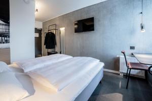 Giường trong phòng chung tại Four Points Flex by Sheraton Aalborg