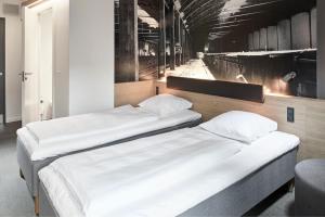 Giường trong phòng chung tại Four Points Flex by Sheraton Aalborg