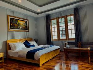 Giường trong phòng chung tại Areena Hotel +66 ảnh