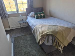 Postel nebo postele na pokoji v ubytování Dún Eoin Carrigaline