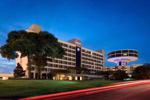 a large building with a building with a tower at Houston Airport Marriott at George Bush Intercontinental in Houston