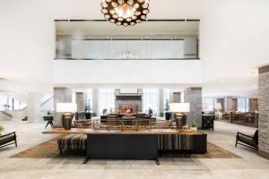 a lobby of a hotel with a fireplace at Kananaskis Mountain Lodge, Autograph Collection in Kananaskis Village