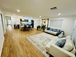a living room with a couch and a table at Cozy Homez Ballarat - Home stay in Alfredton