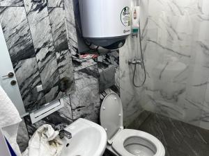 a bathroom with a toilet and a sink at Obzor in Obzor +15 photos