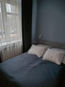 Posteľ alebo postele v izbe v ubytovaní Nowa Huta
