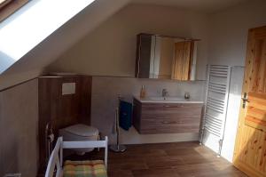 a bathroom with a sink and a mirror at Landhaus Grimburg - Ferienwohnungen im Parterre und Obergeschoss in Grimburg +33 photos
