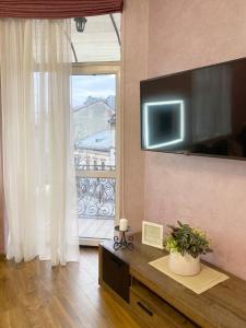 Et tv og/eller underholdning på Apartment ЖД вокзал, Центр