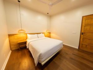 Postel nebo postele na pokoji v ubytování Noorani Retreat Dhiffushi