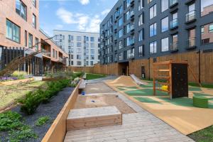 a courtyard in a building with a skate park at Revalia Lastekodu-Odra Bus Station Airport Apartments in Tallinn