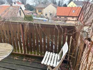 a white bench sitting on top of a balcony at Restaurace a Penzion Podloubí in Opočno +22 photos