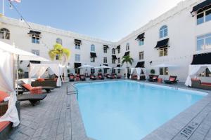 a large swimming pool in front of a hotel at Casa Monica Resort & Spa, Autograph Collection in St. Augustine