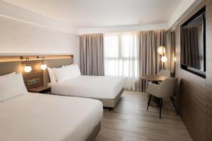 Postel nebo postele na pokoji v ubytování AC Hotel by Marriott St Julian's