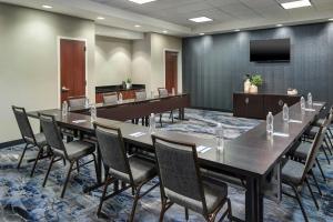 a conference room with a long table and chairs at Fairfield Inn & Suites by Marriott Jackson in Jackson