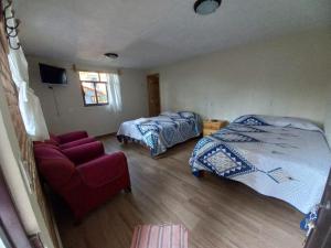 Postel nebo postele na pokoji v ubytování Cabaña La Hacienda 1