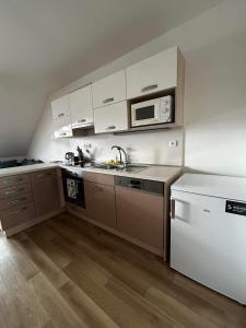 Kuchyň nebo kuchyňský kout v ubytování Sladký apartmán