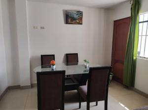 a dining room with a table and chairs at no disponibl in Trujillo
