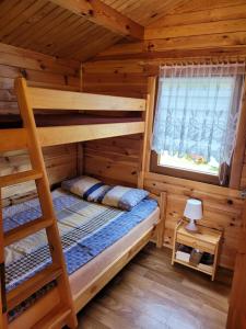 Postel nebo postele na pokoji v ubytování Domki Letniskowe ,,Tęcza"