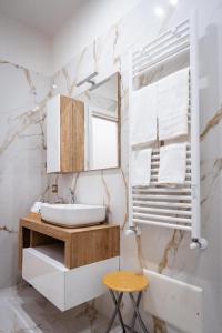 a bathroom with a sink and a mirror at Mar House & Suites Guest House in Castellammare di Stabia +23 photos