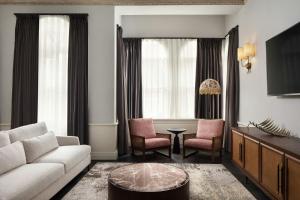 a living room with a couch and chairs and a table at Adahan DeCamondo Pera, Autograph Collection in Istanbul