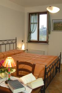 Postel nebo postele na pokoji v ubytování Agriturismo I Grappoli