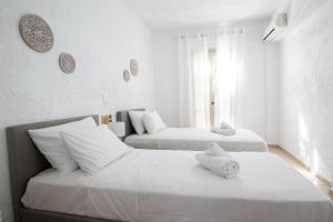 Postel nebo postele na pokoji v ubytování Hesperia Apartments by Estia