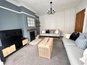 Posezení v ubytování Willowdene Cottage by the Sea